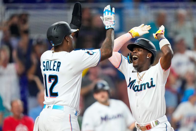 Sep 17, 2023; Miami, Florida, USA; Miami Marlins center fielder Jazz Chisholm Jr. (2) celebrates with Miami Marlins designated hitter Jorge Soler (12) after hitting a grand slam against the Atlanta Braves at loanDepot Park. Mandatory Credit: Rich Storry-USA TODAY Sports