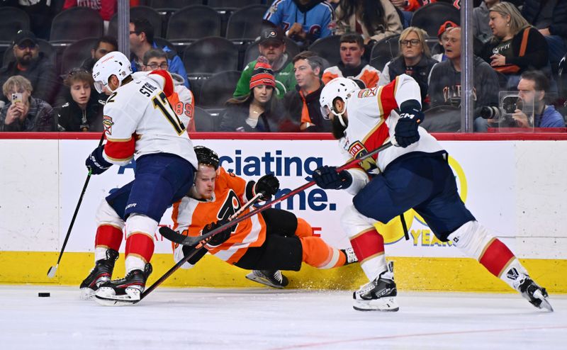 Mar 21, 2023; Philadelphia, Pennsylvania, USA; Philadelphia Flyers right wing Owen Tippett (74) collides with Florida Panthers center Eric Staal (12) in the third period at Wells Fargo Center. Mandatory Credit: Kyle Ross-USA TODAY Sports