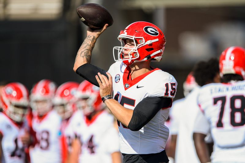 Oct 14, 2023; Nashville, Tennessee, USA;  Georgia Bulldogs quarterback Carson Beck (15) throws during the warmup period before a game against the Vanderbilt Commodores at FirstBank Stadium. Mandatory Credit: Steve Roberts-USA TODAY Sports