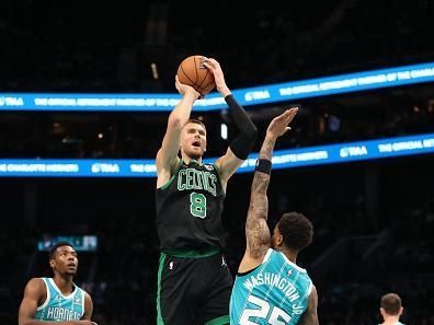 CHARLOTTE, NC - NOVEMBER 20: Kristaps Porzingis #8 of the Boston Celtics shoots the ball during the game against the Charlotte Hornets on November 20, 2023 at Spectrum Center in Charlotte, North Carolina. NOTE TO USER: User expressly acknowledges and agrees that, by downloading and or using this photograph, User is consenting to the terms and conditions of the Getty Images License Agreement.  Mandatory Copyright Notice:  Copyright 2023 NBAE (Photo by Brock Williams-Smith/NBAE via Getty Images)