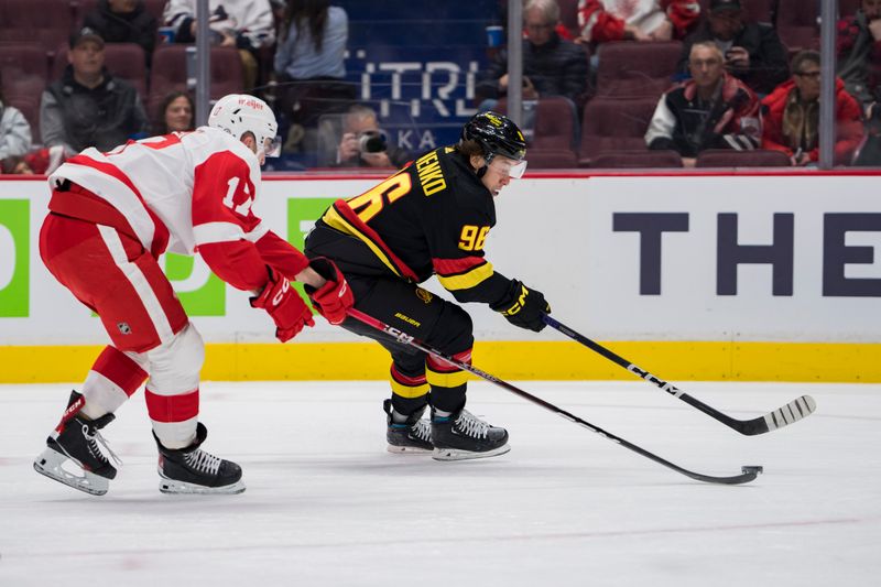 Feb 13, 2023; Vancouver, British Columbia, CAN; Vancouver Canucks forward Andrei Kuzmenko (96) drives past Detroit Red Wings defenseman Filip Hronek (17) in the first period at Rogers Arena. Mandatory Credit: Bob Frid-USA TODAY Sports