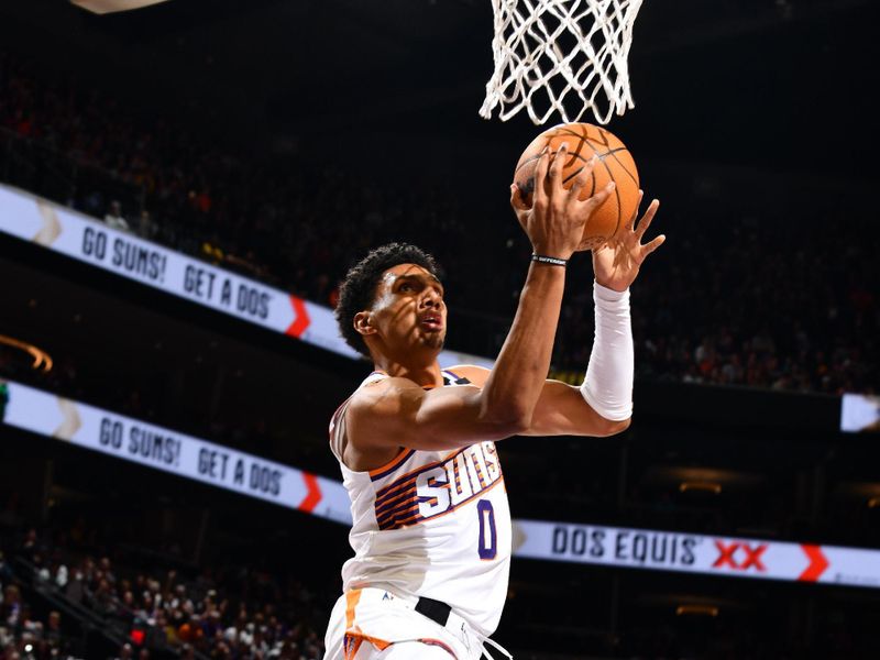 PHOENIX, AZ - OCTOBER 28: Ryan Dunn #0 of the Phoenix Suns shoots the ball during the game against the Los Angeles Lakers on October 28, 2024 at Footprint Center in Phoenix, Arizona. NOTE TO USER: User expressly acknowledges and agrees that, by downloading and or using this photograph, user is consenting to the terms and conditions of the Getty Images License Agreement. Mandatory Copyright Notice: Copyright 2024 NBAE (Photo by Barry Gossage/NBAE via Getty Images)