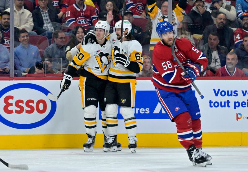 Oct 14, 2024; Montreal, Quebec, CAN; Pittsburgh Penguins forward Lars Eller (20) celebrates with teammate defenseman Erik Karlsson (65) after scoring a goal against the Montreal Canadiens during the first period at the Bell Centre. Mandatory Credit: Eric Bolte-Imagn Images