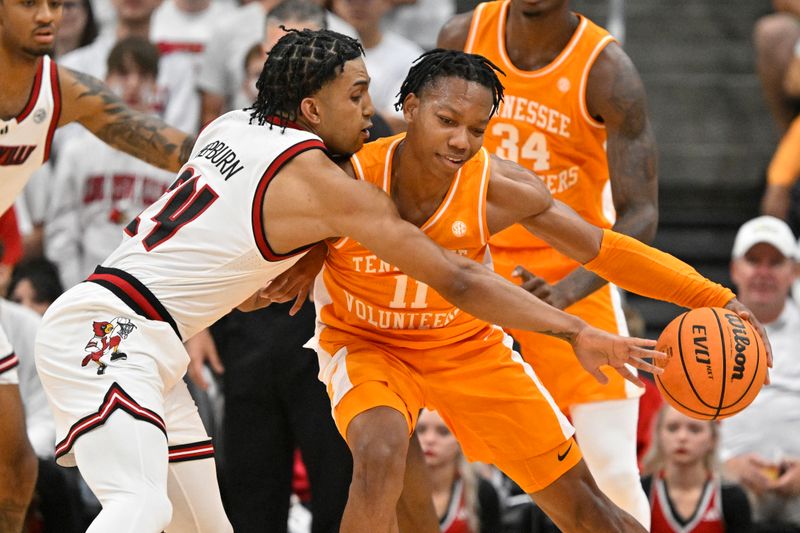 Nov 9, 2024; Louisville, Kentucky, USA;  Louisville Cardinals guard Chucky Hepburn (24) pressures the dribble of Tennessee Volunteers guard Jordan Gainey (11) during the second half at KFC Yum! Center. Tennessee defeated Louisville 77-55. Mandatory Credit: Jamie Rhodes-Imagn Images