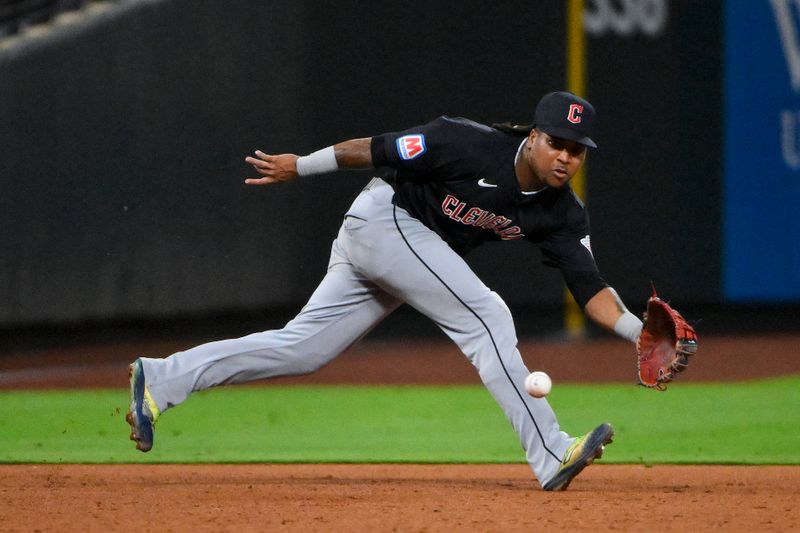 Sep 20, 2024; St. Louis, Missouri, USA;  Cleveland Guardians third baseman Jose Ramirez (11) fields a ground ball against the St. Louis Cardinals during the seventh inning at Busch Stadium. Mandatory Credit: Jeff Curry-Imagn Images