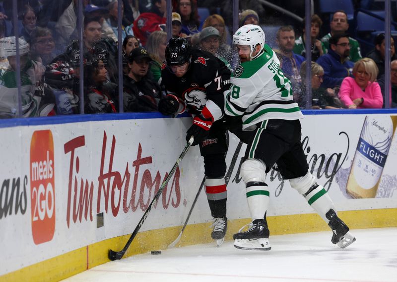 Feb 6, 2024; Buffalo, New York, USA;  Dallas Stars center Sam Steel (18) checks Buffalo Sabres defenseman Connor Clifton (75) as he goes after a loose puck during the first period at KeyBank Center. Mandatory Credit: Timothy T. Ludwig-USA TODAY Sports