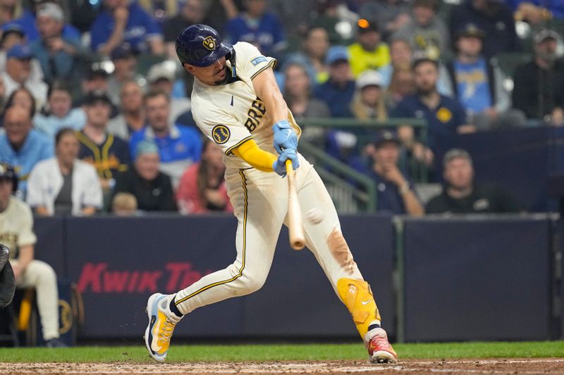 Jun 10, 2024; Milwaukee, Wisconsin, USA;  Milwaukee Brewers shortstop Willy Adames (27) hits a home run  during the fourth inning against the Toronto Blue Jays at American Family Field. Mandatory Credit: Jeff Hanisch-USA TODAY Sports