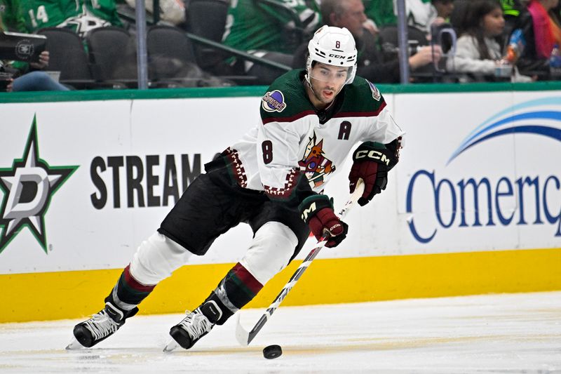 Nov 14, 2023; Dallas, Texas, USA; Arizona Coyotes center Nick Schmaltz (8) skates against the Dallas Stars during the second period at the American Airlines Center. Mandatory Credit: Jerome Miron-USA TODAY Sports