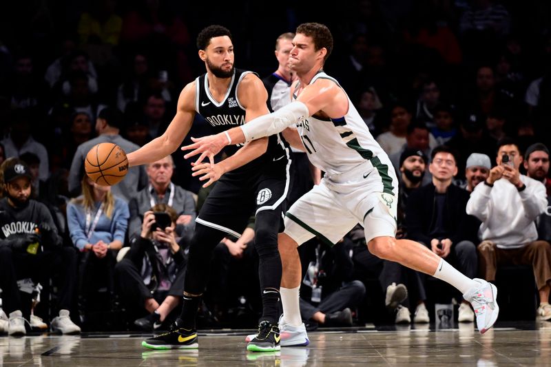 NEW YORK, NEW YORK - DECEMBER 08:  Ben Simmons #10 of the Brooklyn Nets is defended by Brook Lopez #11 of the Milwaukee Bucks during the first half at Barclays Center on December 08, 2024 in New York City. NOTE TO USER: User expressly acknowledges and agrees that, by downloading and or using this Photograph, user is consenting to the terms and conditions of the Getty Images License Agreement.  (Photo by Steven Ryan/Getty Images)