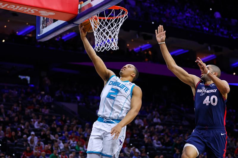 PHILADELPHIA, PENNSYLVANIA - MARCH 16: Grant Williams #2 of the Charlotte Hornets attempts a layup as Nicolas Batum #40 of the Philadelphia 76ers defends during the first half of a game at the Wells Fargo Center on March 16, 2024 in Philadelphia, Pennsylvania. NOTE TO USER: User expressly acknowledges and agrees that, by downloading and or using this photograph, User is consenting to the terms and conditions of the Getty Images License Agreement. (Photo by Rich Schultz/Getty Images)