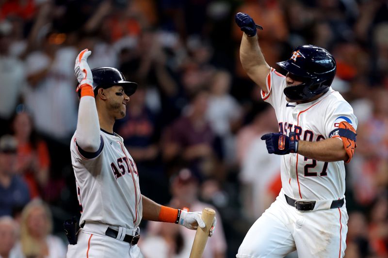 Aug 18, 2024; Houston, Texas, USA; Houston Astros designated hitter Jose Altuve (27) is congratulated by  shortstop Jeremy Peña (3) after hitting a home run to left field against the Chicago White Sox during the eighth inning at Minute Maid Park. Mandatory Credit: Erik Williams-USA TODAY Sports