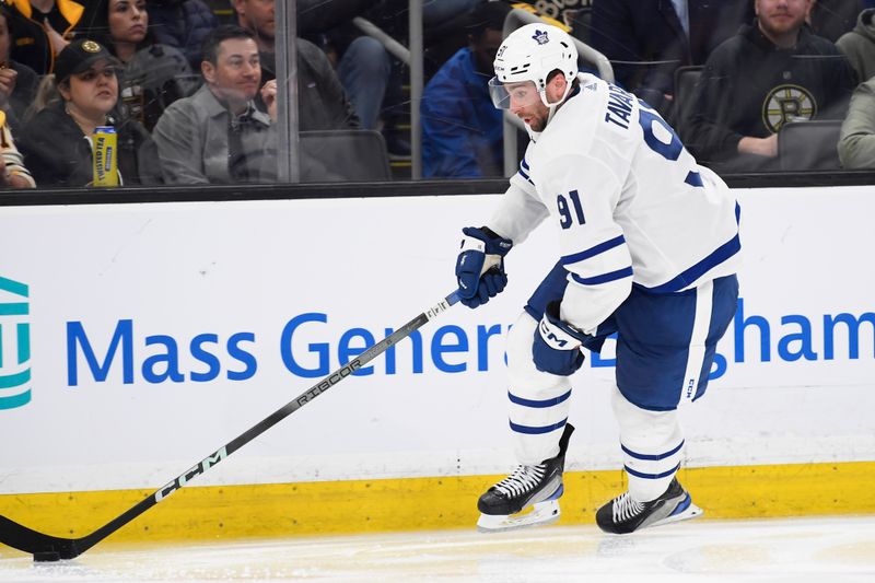 Apr 30, 2024; Boston, Massachusetts, USA; Toronto Maple Leafs center John Tavares (91) skates with the puck during overtime in game five of the first round of the 2024 Stanley Cup Playoffs against the Boston Bruins at TD Garden. Mandatory Credit: Bob DeChiara-USA TODAY Sports