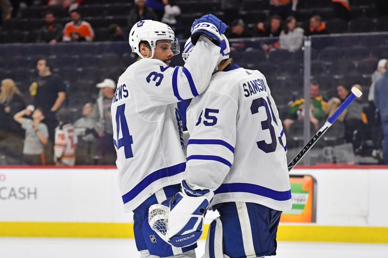 Mar 14, 2024; Philadelphia, Pennsylvania, USA; Toronto Maple Leafs center Auston Matthews (34) and goaltender Ilya Samsonov (35) celebrate win against the Philadelphia Flyers  at Wells Fargo Center. Mandatory Credit: Eric Hartline-USA TODAY Sports