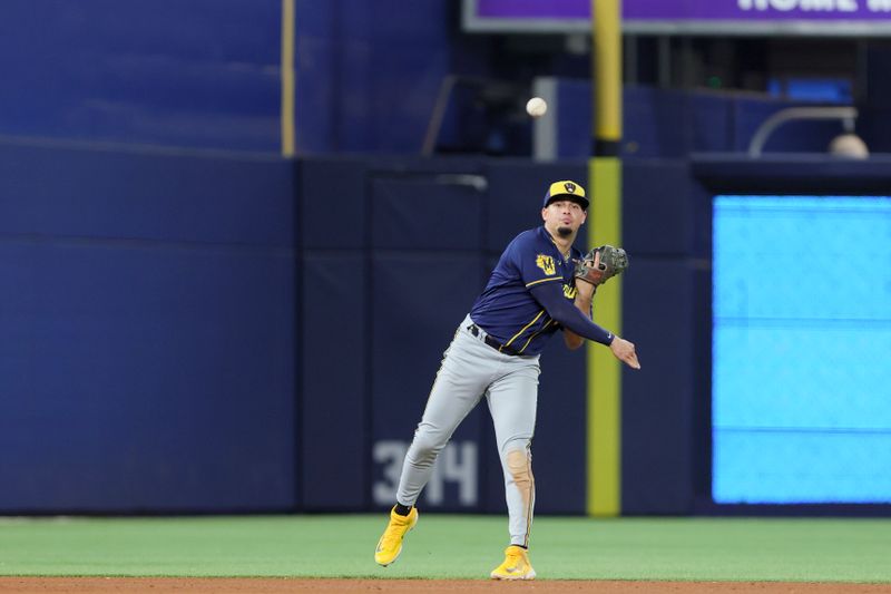 Sep 24, 2023; Miami, Florida, USA; Milwaukee Brewers shortstop Willy Adames (27) throws to first base and retires Miami Marlins left fielder Bryan De La Cruz (not pictured) during the sixth inning at loanDepot Park. Mandatory Credit: Sam Navarro-USA TODAY Sports