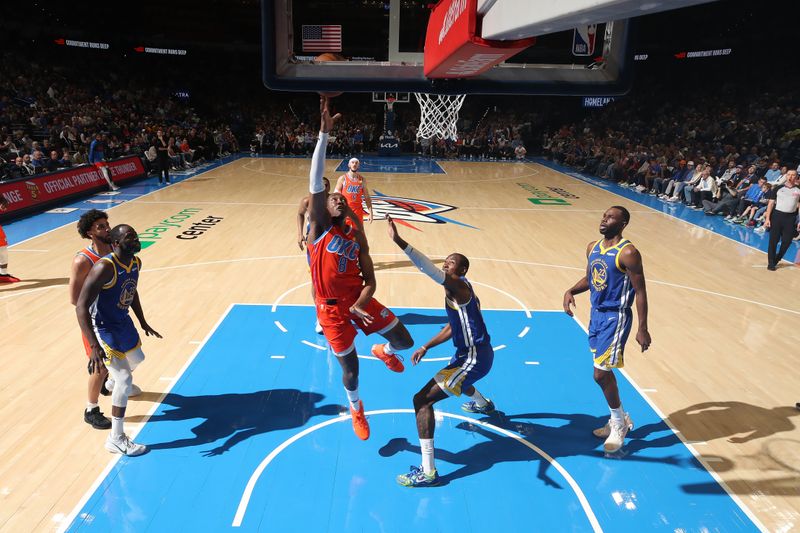 OKLAHOMA CITY, OK - NOVEMBER 10: Jalen Williams #8 of the Oklahoma City Thunder drives to the basket during the game against the Golden State Warriors on November 10, 2024 at Paycom Center in Oklahoma City, Oklahoma. NOTE TO USER: User expressly acknowledges and agrees that, by downloading and or using this photograph, User is consenting to the terms and conditions of the Getty Images License Agreement. Mandatory Copyright Notice: Copyright 2024 NBAE (Photo by Zach Beeker/NBAE via Getty Images)