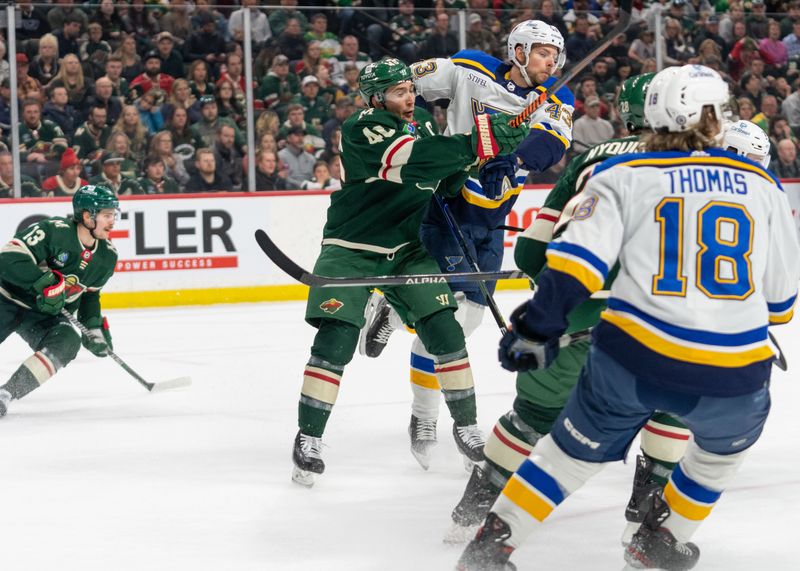 Apr 8, 2023; Saint Paul, Minnesota, USA; St. Louis Blues defenseman Calle Rosen (43) is checked by Minnesota Wild defenseman Jared Spurgeon (46) in the first period at Xcel Energy Center. Mandatory Credit: Matt Blewett-USA TODAY Sports