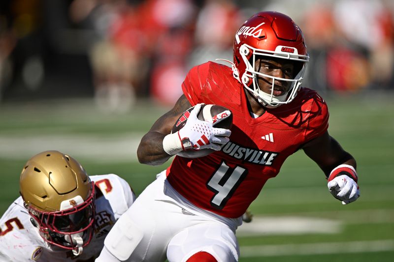 Sep 23, 2023; Louisville, Kentucky, USA;  Louisville Cardinals running back Maurice Turner (4) runs the ball against Boston College Eagles linebacker Kam Arnold (5) during the first half at L&N Federal Credit Union Stadium. Louisville defeated Boston College 56-28. Mandatory Credit: Jamie Rhodes-USA TODAY Sports