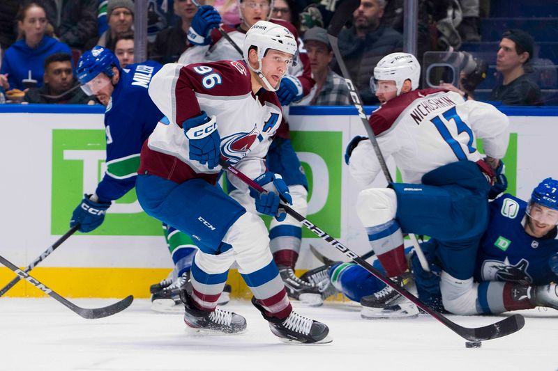 Mar 13, 2024; Vancouver, British Columbia, CAN; Colorado Avalanche forward Mikko Rantanen (96) handles the puck against the Vancouver Canucks in the first period at Rogers Arena. Mandatory Credit: Bob Frid-USA TODAY Sports