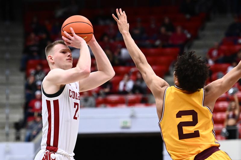 Jan 28, 2023; Pullman, Washington, USA; Washington State Cougars guard Justin Powell (24) shoots the ball against Arizona State Sun Devils guard Austin Nunez (2) in the second half at Friel Court at Beasley Coliseum. Washington State won 75-58. Mandatory Credit: James Snook-USA TODAY Sports