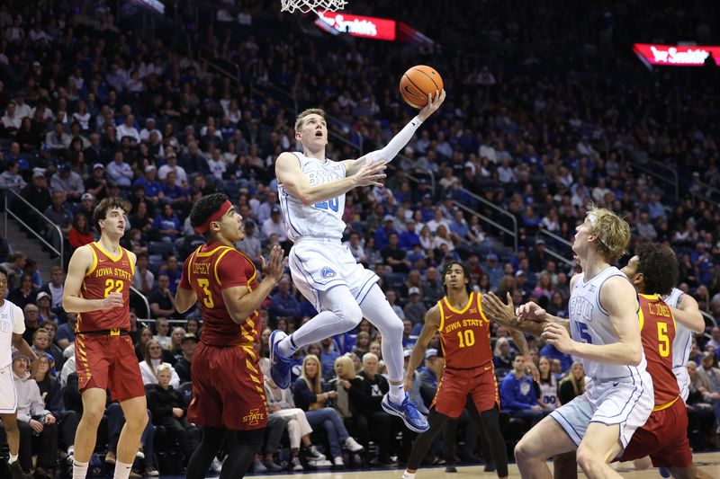 Jan 16, 2024; Provo, Utah, USA; Brigham Young Cougars guard Spencer Johnson (20) goes to the basket against the Iowa State Cyclones during the first half at Marriott Center. Mandatory Credit: Rob Gray-USA TODAY Sports