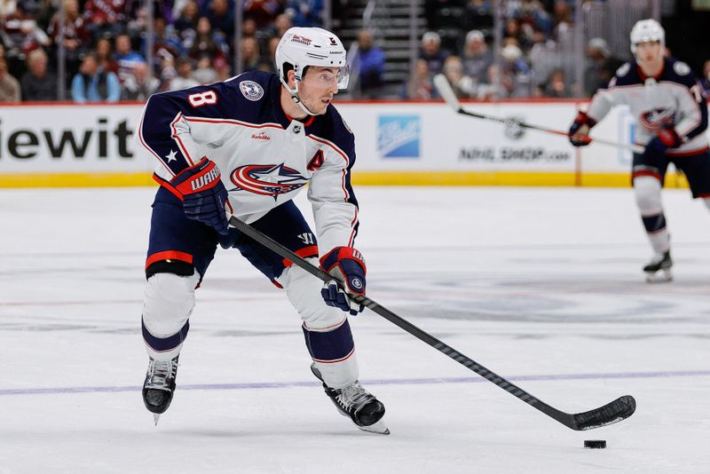 Mar 22, 2024; Denver, Colorado, USA; Columbus Blue Jackets defenseman Zach Werenski (8) controls the puck in the third period against the Colorado Avalanche at Ball Arena. Mandatory Credit: Isaiah J. Downing-USA TODAY Sports