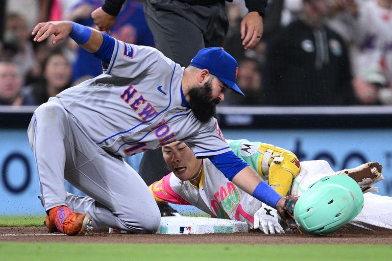 Jul 7, 2023; San Diego, California, USA; San Diego Padres second base Ha-seong Kim (7) is tagged out at third base by New York Mets third baseman Luis Guillorme (13) attempting to stretch a double during the seventh inning at Petco Park. Mandatory Credit: Orlando Ramirez-USA TODAY Sports