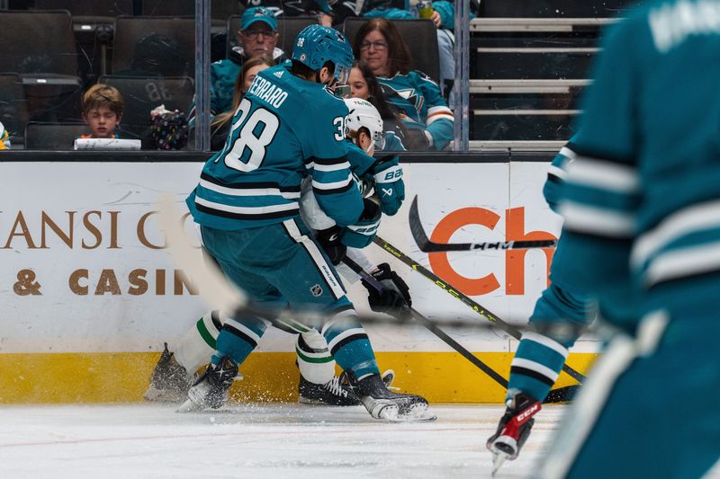 Jan 18, 2023; San Jose, California, USA; San Jose Sharks defenseman Mario Ferraro (38) and Dallas Stars left wing Joel Kiviranta (25) battle for the puck against the boards during the first period at SAP Center at San Jose. Mandatory Credit: Neville E. Guard-USA TODAY Sports