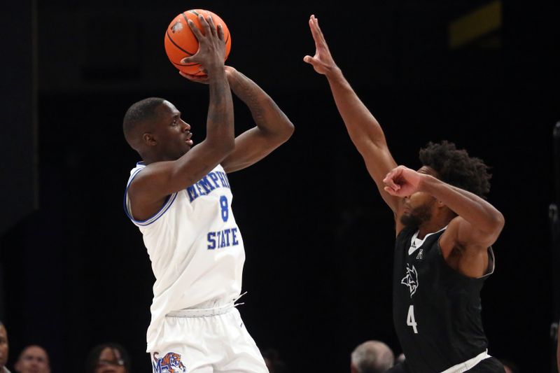 Jan 31, 2024; Memphis, Tennessee, USA; Memphis Tigers forward David Jones (8) shoots as Rice Owls guard Anthony Selden (4) defends during the second half at FedExForum. Mandatory Credit: Petre Thomas-USA TODAY Sports