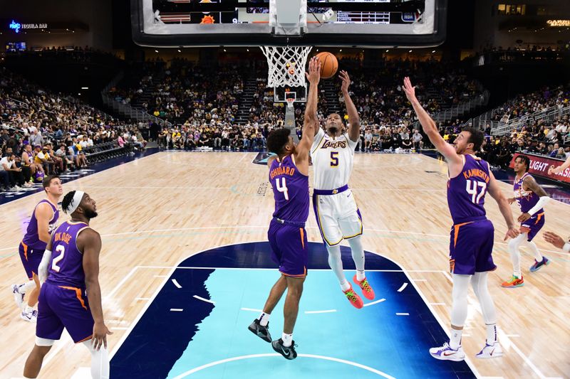 LOS ANGELES, CA - OCTOBER 6: Cam Reddish #5 of the Los Angeles Lakers drives to the basket during the game against the Phoenix Suns on October 6, 2024 at Acrisure Arena in Palm Springs, California. NOTE TO USER: User expressly acknowledges and agrees that, by downloading and/or using this Photograph, user is consenting to the terms and conditions of the Getty Images License Agreement. Mandatory Copyright Notice: Copyright 2024 NBAE (Photo by Adam Pantozzi/NBAE via Getty Images)