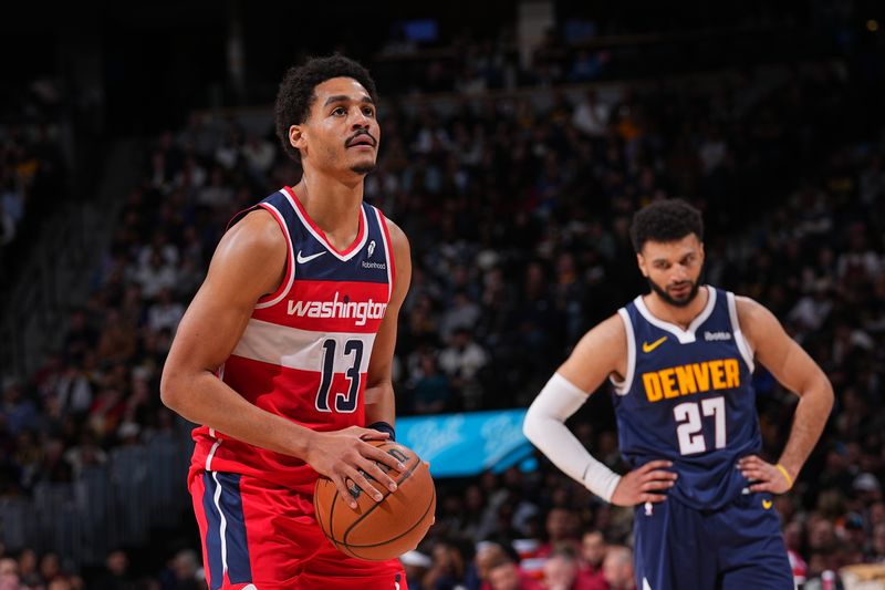 DENVER, CO - FEBRUARY 22: Jordan Poole #13 of the Washington Wizards prepares to shoot a free throw during the game against the Denver Nuggets on February 22, 2024 at the Ball Arena in Denver, Colorado. NOTE TO USER: User expressly acknowledges and agrees that, by downloading and/or using this Photograph, user is consenting to the terms and conditions of the Getty Images License Agreement. Mandatory Copyright Notice: Copyright 2024 NBAE (Photo by Bart Young/NBAE via Getty Images)