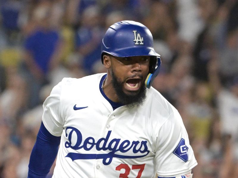 Jul 22, 2024; Los Angeles, California, USA; Los Angeles Dodgers left fielder Teoscar Hernandez (37) celebrates after hitting a RBI single in the eighth inning against the San Francisco Giants at Dodger Stadium. Mandatory Credit: Jayne Kamin-Oncea-USA TODAY Sports