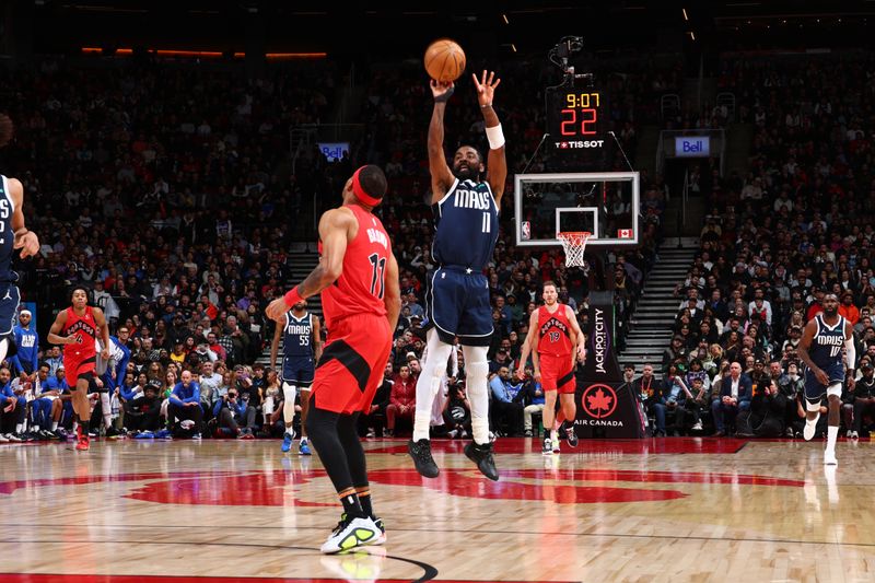 TORONTO, CANADA - FEBRUARY 28: Kyrie Irving #11 of the Dallas Mavericks shoots the ball during the game against the Toronto Raptors on February 28, 2024 at the Scotiabank Arena in Toronto, Ontario, Canada.  NOTE TO USER: User expressly acknowledges and agrees that, by downloading and or using this Photograph, user is consenting to the terms and conditions of the Getty Images License Agreement.  Mandatory Copyright Notice: Copyright 2024 NBAE (Photo by Vaughn Ridley/NBAE via Getty Images)