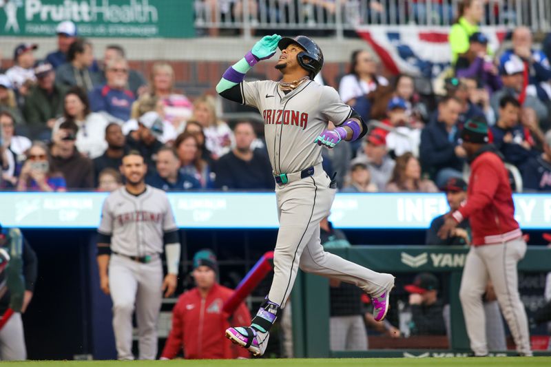 Apr 6, 2024; Atlanta, Georgia, USA; Arizona Diamondbacks second baseman Ketel Marte (4) reacts after a home run against the Atlanta Braves in the first inning at Truist Park. Mandatory Credit: Brett Davis-USA TODAY Sports