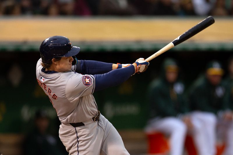 May 24, 2024; Oakland, California, USA; Houston Astros center fielder Jake Meyers (6) follows through on his three-run home run against the Oakland Athletics during the fourth inning at Oakland-Alameda County Coliseum. Mandatory Credit: D. Ross Cameron-USA TODAY Sports