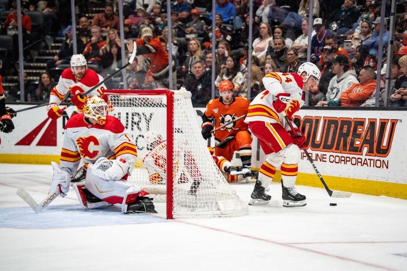 Mar 1, 2026; Anaheim, California, USA; Calgary Flames defenseman Joel Hanley (44) clears the puck during the second period in the match against the Anaheim Ducks at Honda Center. Mandatory Credit: Corinne Votaw-Imagn Images