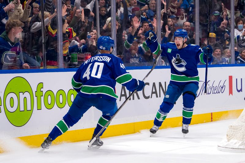 Apr 16, 2024; Vancouver, British Columbia, CAN;  Vancouver Canucks forward Elias Pettersson (40) and forward Nils Hoglander (21) celebrate Hoglander’s goal against the Calgary Flames in the first period at Rogers Arena. Mandatory Credit: Bob Frid-USA TODAY Sports