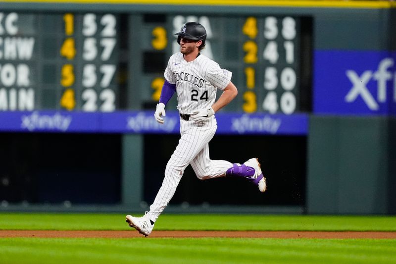 Jun 7, 2025; Denver, Colorado, USA; Colorado Rockies third base Ryan McMahon (24) runs off a solo home run in the fourth inning against the New York Mets at Coors Field. Mandatory Credit: Ron Chenoy-Imagn Images
