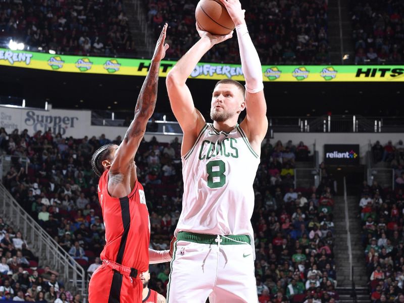 HOUSTON, TX - JANUARY 3:  Kristaps Porzingis #8 of the Boston Celtics shoots the ball during the game against the Houston Rockets on January 3, 2025 at the Toyota Center in Houston, Texas. NOTE TO USER: User expressly acknowledges and agrees that, by downloading and or using this photograph, User is consenting to the terms and conditions of the Getty Images License Agreement. Mandatory Copyright Notice: Copyright 2025 NBAE (Photo by Logan Riely/NBAE via Getty Images)