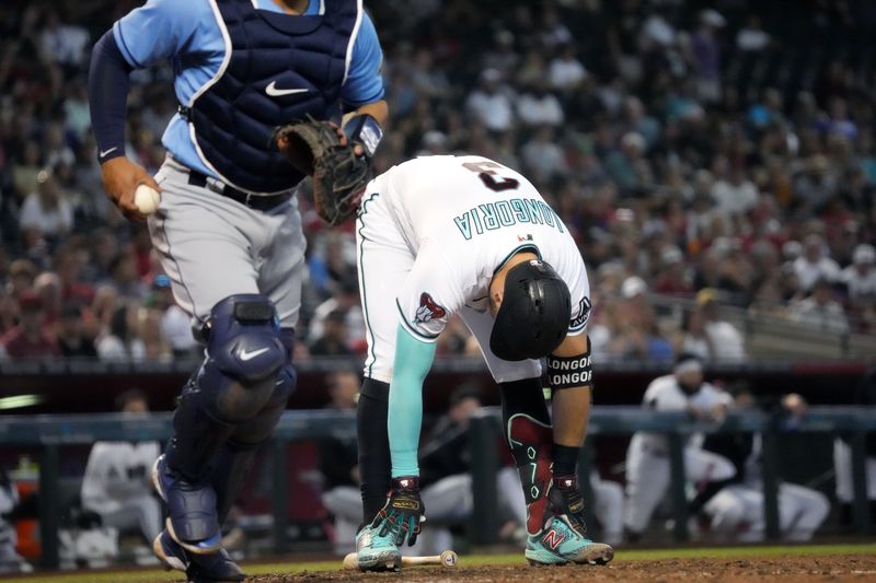 Jun 29, 2023; Phoenix, Arizona, USA; Arizona Diamondbacks third baseman Evan Longoria (3) reacts to being called out on strikes against the Tampa Bay Rays at Chase Field. Mandatory Credit: Joe Rondone-USA TODAY Sports