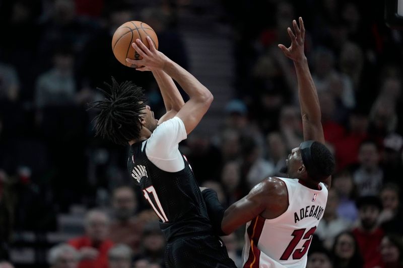 PORTLAND, OREGON - JANUARY 11: Shaedon Sharpe #17 of the Portland Trail Blazers shoots the ball over Bam Adebayo #13 of the Miami Heat during the first half at Moda Center on January 11, 2025 in Portland, Oregon. NOTE TO USER: User expressly acknowledges and agrees that, by downloading and or using this photograph, User is consenting to the terms and conditions of the Getty Images License Agreement. (Photo by Soobum Im/Getty Images)