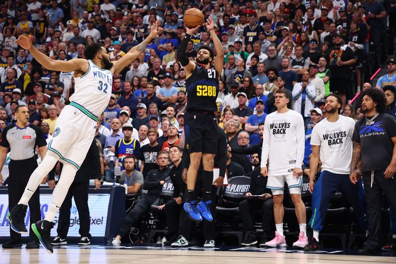 DENVER, COLORADO - MAY 19: Jamal Murray #27 of the Denver Nuggets shoots a three point shot against Karl-Anthony Towns #32 of the Minnesota Timberwolves during the first quarter in Game Seven of the Western Conference Second Round Playoffs at Ball Arena on May 19, 2024 in Denver, Colorado. NOTE TO USER: User expressly acknowledges and agrees that, by downloading and or using this photograph, User is consenting to the terms and conditions of the Getty Images License Agreement. (Photo by C. Morgan Engel/Getty Images)