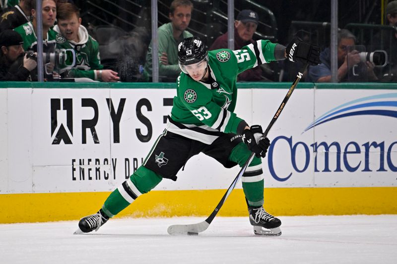 Nov 20, 2024; Dallas, Texas, USA; Dallas Stars center Wyatt Johnston (53) controls the puck during the first period against the San Jose Sharks at the American Airlines Center. Mandatory Credit: Jerome Miron-Imagn Images