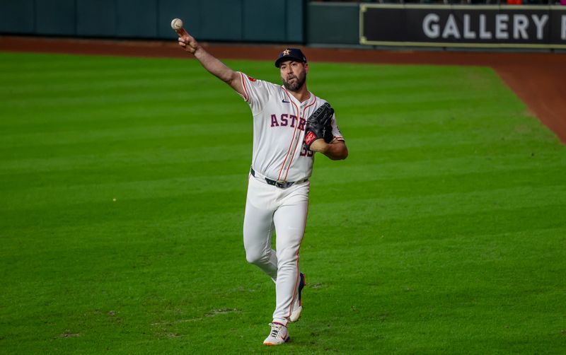 Aug 21, 2024; Houston, Texas, USA;  Houston Astros starting pitcher Justin Verlander (35) warms up before pitching against the Boston Red Sox at Minute Maid Park. Mandatory Credit: Thomas Shea-USA TODAY Sports