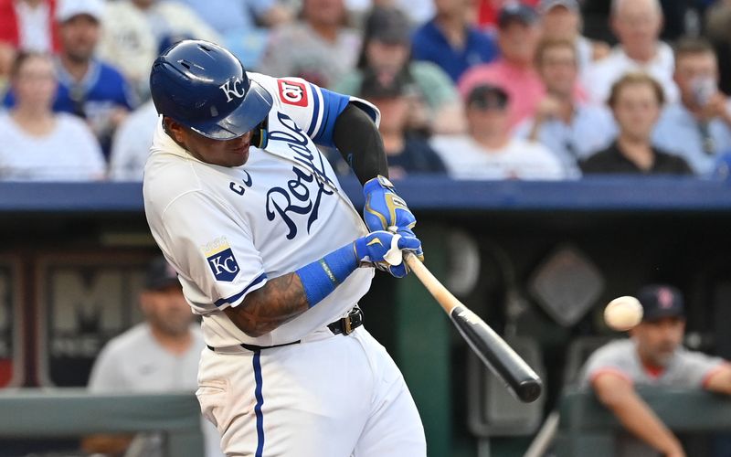 Aug 5, 2024; Kansas City, Missouri, USA;  Kansas City Royals catcher Salvador Perez (13) singles in the second inning against the Boston Red Sox at Kauffman Stadium. Mandatory Credit: Peter Aiken-USA TODAY Sports