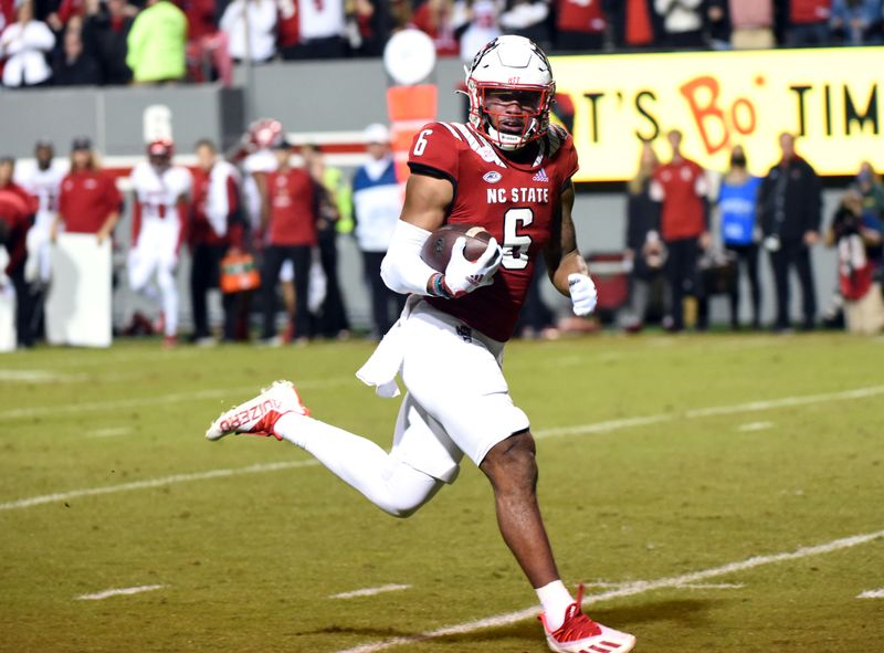 Oct 30, 2021; Raleigh, North Carolina, USA;  North Carolina State Wolfpack running back Trent Pennix (6) runs to the end zone during the second half against the Louisville Cardinals at Carter-Finley Stadium.  The Wolfpack won 28-13.  Mandatory Credit: Rob Kinnan-USA TODAY Sports