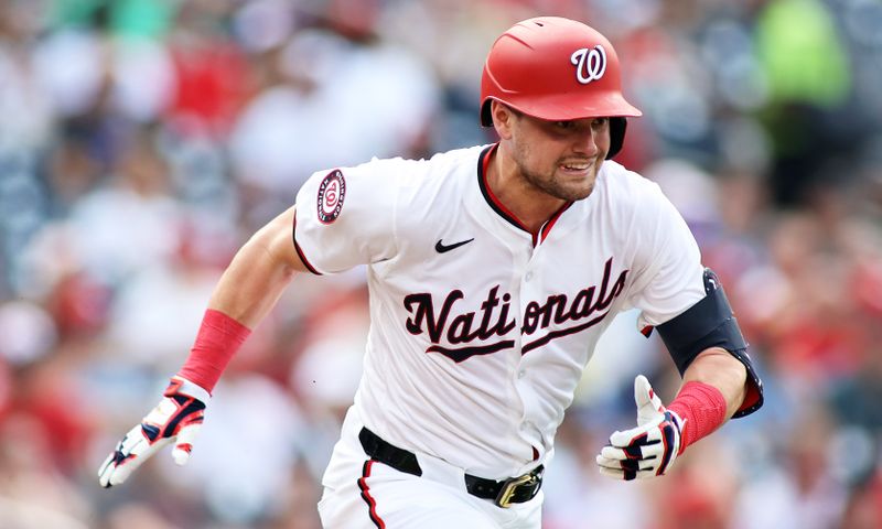 Jul 6, 2024; Washington, District of Columbia, USA; Washington Nationals outfielder Lane Thomas (28) singles during the first inning against the St. Louis Cardinals at Nationals Park. Mandatory Credit: Daniel Kucin Jr.-USA TODAY Sports