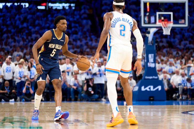 OKLAHOMA CITY, OKLAHOMA - APRIL 21: Herbert Jones #5 of the New Orleans Pelicans brings the ball up court against the Oklahoma City Thunder in game one of the Western Conference First Round Playoffs at the Paycom Center on April 21, 2024 in Oklahoma City, Oklahoma. NOTE TO USER: User expressly acknowledges and agrees that, by downloading and or using this photograph, User is consenting to the terms and conditions of the Getty Images License Agreement.  (Photo by Cooper Neill/Getty Images)