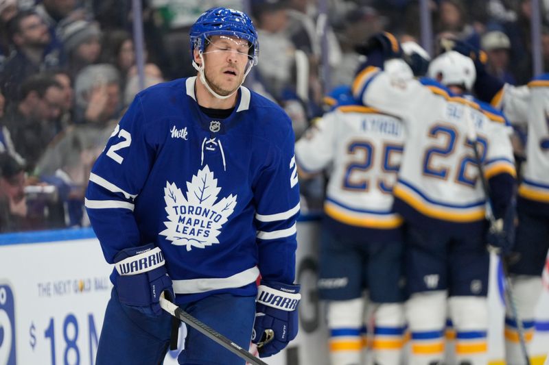 Oct 24, 2024; Toronto, Ontario, CAN; Toronto Maple Leafs defenseman Jake McCabe (22) reacts as the St. Louis Blues celebrate a goal by forward Alexandre Texier (not pictured) during the second period at Scotiabank Arena. Mandatory Credit: John E. Sokolowski-Imagn Images