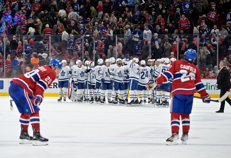 Mar 9, 2024; Montreal, Quebec, CAN; The Toronto Maple Leafs celebrate the win against the Montreal Canadiens at the Bell Centre. Mandatory Credit: Eric Bolte-USA TODAY Sports