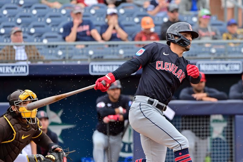 Feb 26, 2024; Peoria, Arizona, USA;  Cleveland Guardians second baseman Andres Gimenez (0) grounds out in the first inning against the San Diego Padres during a spring training game at Peoria Sports Complex. Mandatory Credit: Matt Kartozian-USA TODAY Sports